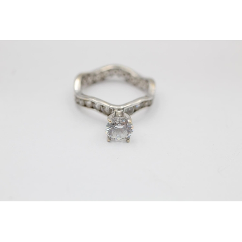 2308 - A 9ct white gold clear gemstone engagement band and wedding ring set, size J½ - approx. gross weight... 