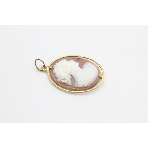 2315 - A 15ct gold framed shell cameo pendant with a female portrait - approx. gross weight 1.6 grams