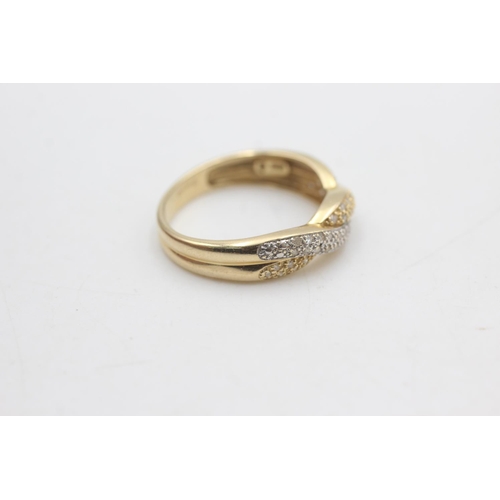 2320 - A hallmarked Sheffield 14ct gold two tone diamond twist front ring, size T - approx. gross weight 3.... 