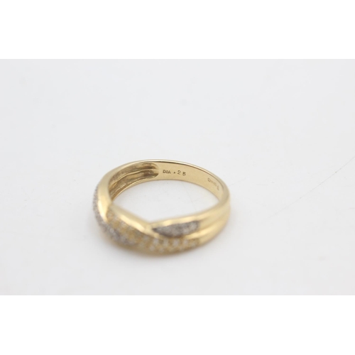 2320 - A hallmarked Sheffield 14ct gold two tone diamond twist front ring, size T - approx. gross weight 3.... 