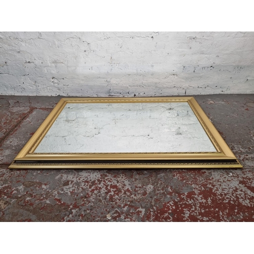 1215 - A modern rectangular wall mirror - approx. 106cm x 76cm