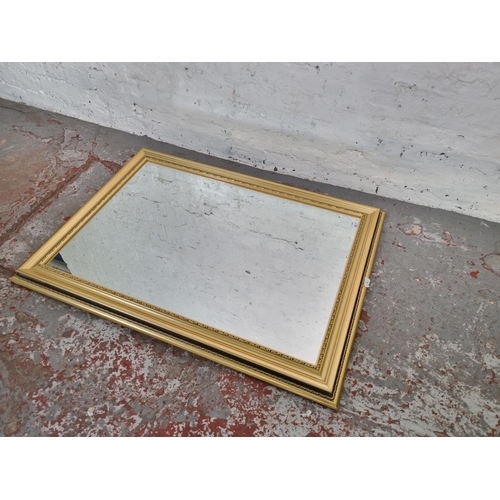 1215 - A modern rectangular wall mirror - approx. 106cm x 76cm