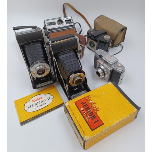 1225 - Five Kodak cameras, one cased late 1950s Sterling II folding for 620 film with instruction manual, o... 