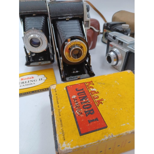 1225 - Five Kodak cameras, one cased late 1950s Sterling II folding for 620 film with instruction manual, o... 