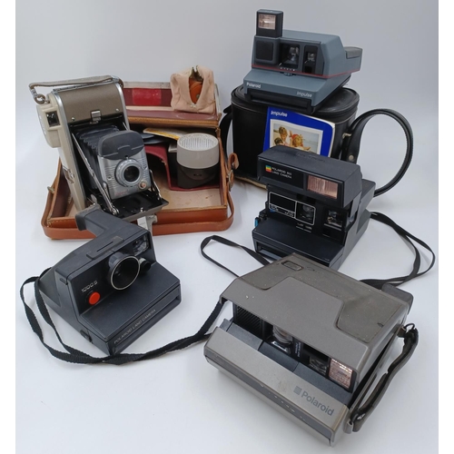 1226 - Five Polaroid cameras to include cased late 1950s/early1960s Highlander 80B folding land camera for ... 