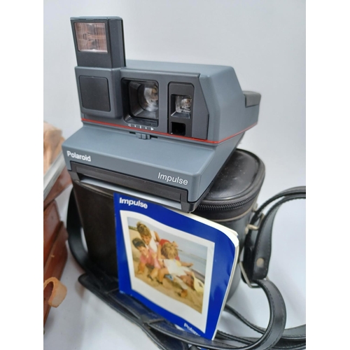 1226 - Five Polaroid cameras to include cased late 1950s/early1960s Highlander 80B folding land camera for ... 