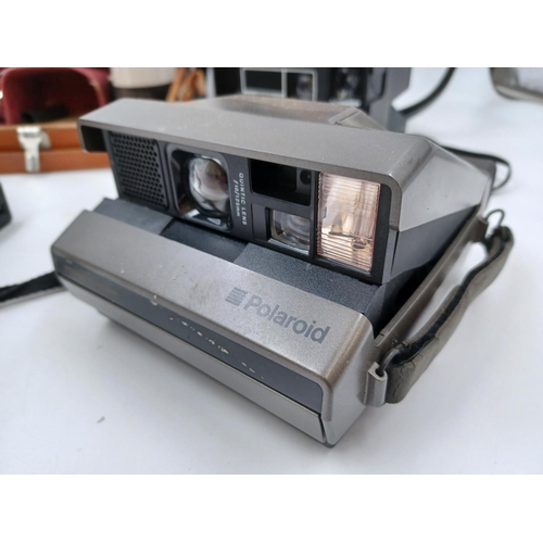 1226 - Five Polaroid cameras to include cased late 1950s/early1960s Highlander 80B folding land camera for ... 