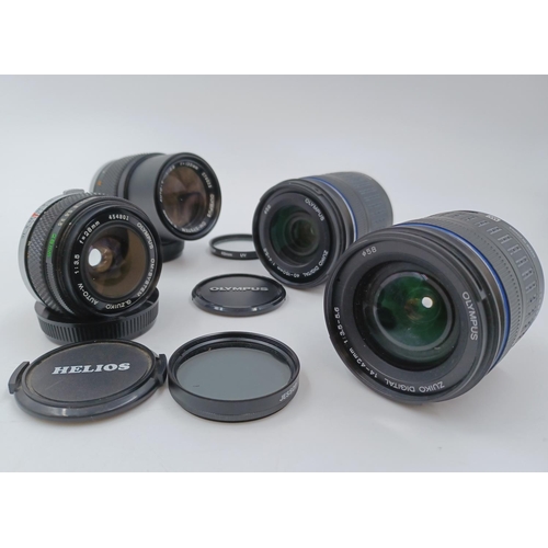 1230 - Four Olympus lenses, one Zuiko digital 1:3.5-5.6 Ø58 14-42mm, one OM-System G.Zuiko Auto-W 1:3.5 f=2... 