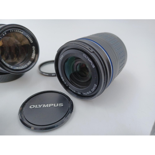 1230 - Four Olympus lenses, one Zuiko digital 1:3.5-5.6 Ø58 14-42mm, one OM-System G.Zuiko Auto-W 1:3.5 f=2... 