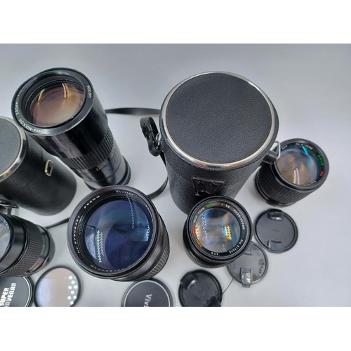 1231 - A large collection of lenses to include cased Super Ozeck auto zoom MC 1:3.8 f=75-150mm, cased Super... 