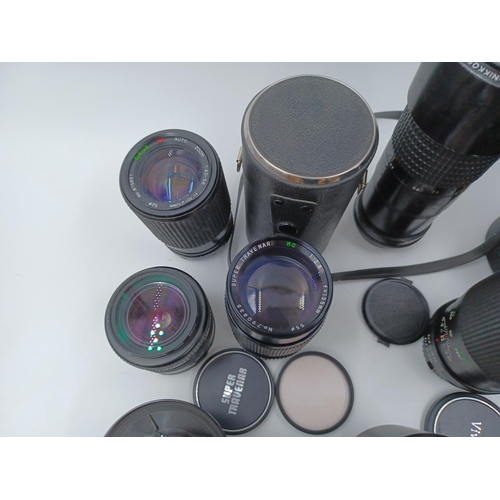 1231 - A large collection of lenses to include cased Super Ozeck auto zoom MC 1:3.8 f=75-150mm, cased Super... 