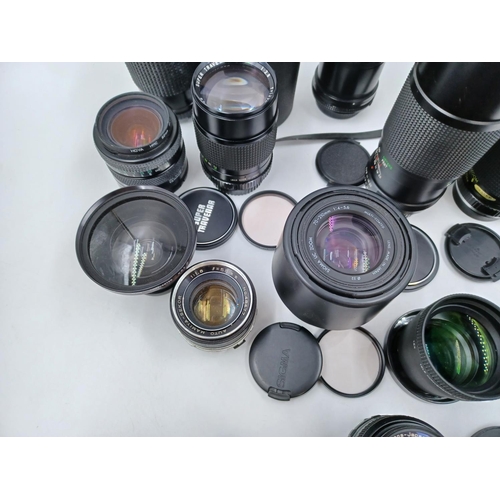 1231 - A large collection of lenses to include cased Super Ozeck auto zoom MC 1:3.8 f=75-150mm, cased Super... 