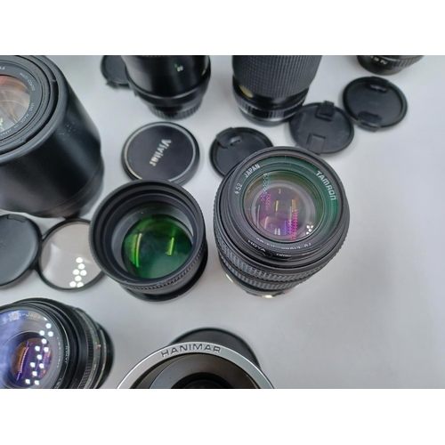 1231 - A large collection of lenses to include cased Super Ozeck auto zoom MC 1:3.8 f=75-150mm, cased Super... 