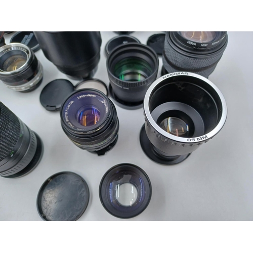 1231 - A large collection of lenses to include cased Super Ozeck auto zoom MC 1:3.8 f=75-150mm, cased Super... 