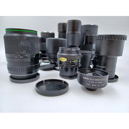 1231 - A large collection of lenses to include cased Super Ozeck auto zoom MC 1:3.8 f=75-150mm, cased Super... 