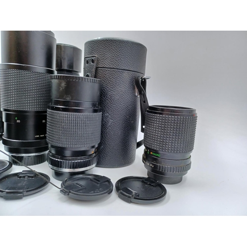 1231 - A large collection of lenses to include cased Super Ozeck auto zoom MC 1:3.8 f=75-150mm, cased Super... 