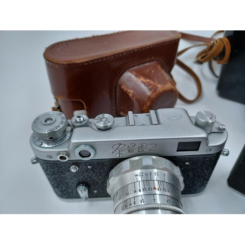 1232 - Four items, one cased FED 2 35mm rangefinder camera, one Helios-44-2 2/58 lens, one cased KMZ Zenit ... 