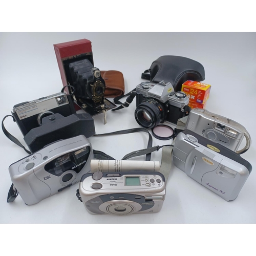 1239 - Seven cameras to include cased Minolta X-300 35mm SLR, Kodak No.2 folding autographic Brownie for 12... 