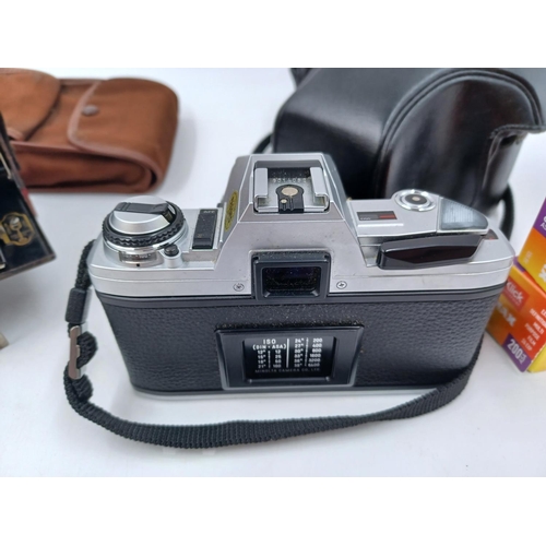 1239 - Seven cameras to include cased Minolta X-300 35mm SLR, Kodak No.2 folding autographic Brownie for 12... 