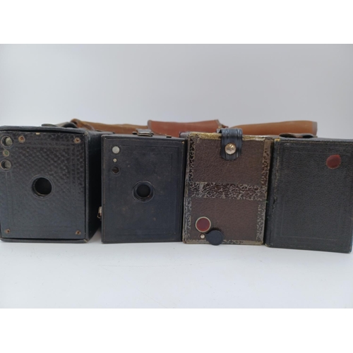 1240 - Four box cameras, one Canadian Kodak No.2 Brownie for 120 film, one British Kodak No.2 Brownie for 1... 