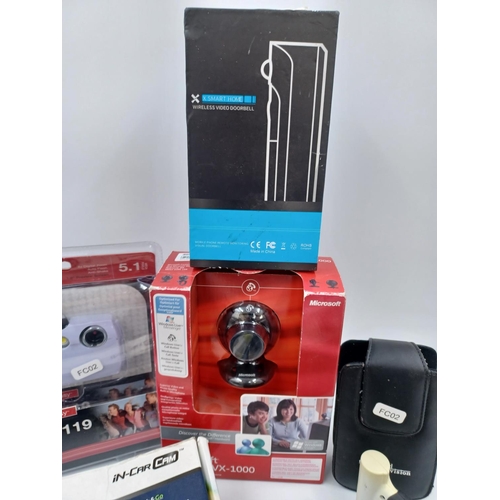 1245 - A collection of items to include boxed Next Base 402G iN-Car Cam, packaged Vivitar ViviCam 5119 5.1m... 