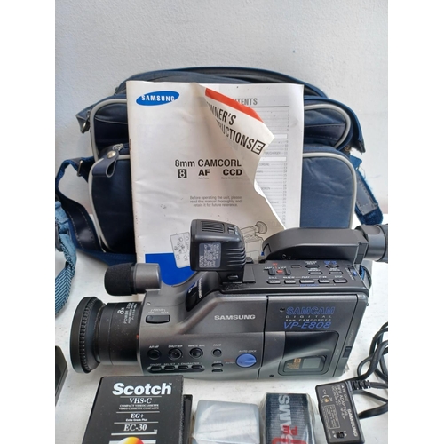 1250 - Two cased camcorders with accessories, instruction manuals and blank media, one Panasonic MS70 and o... 