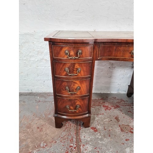 1108A - A Regency style mahogany serpentine pedestal desk with nine drawers and tan leather insert - approx.... 