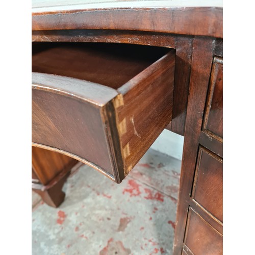 1108A - A Regency style mahogany serpentine pedestal desk with nine drawers and tan leather insert - approx.... 