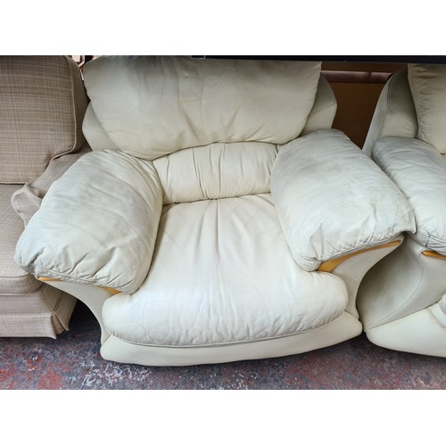 1155B - A modern cream leather and beech three piece lounge suite comprising three seater sofa and two armch... 