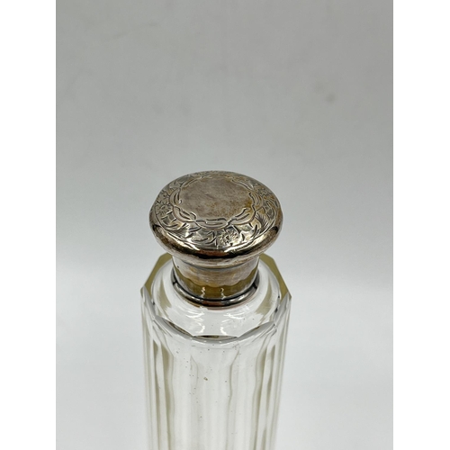 284 - Three cut glass scent bottles with sterling silver tops to include Victorian bottle, dated 1886 - ap... 