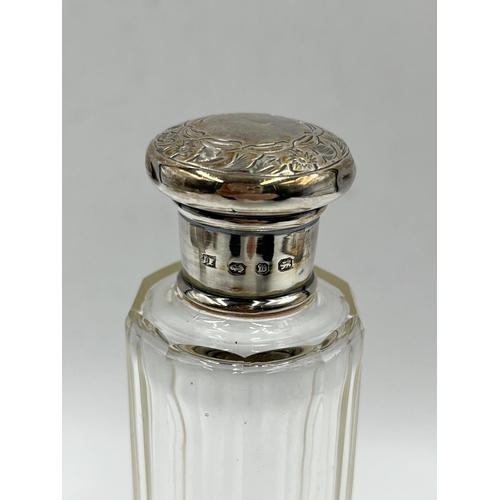 284 - Three cut glass scent bottles with sterling silver tops to include Victorian bottle, dated 1886 - ap... 