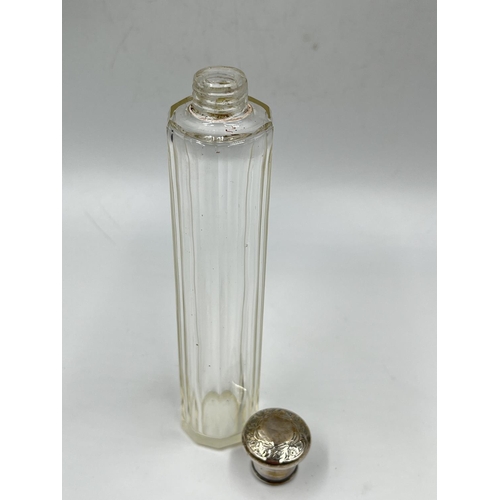 284 - Three cut glass scent bottles with sterling silver tops to include Victorian bottle, dated 1886 - ap... 