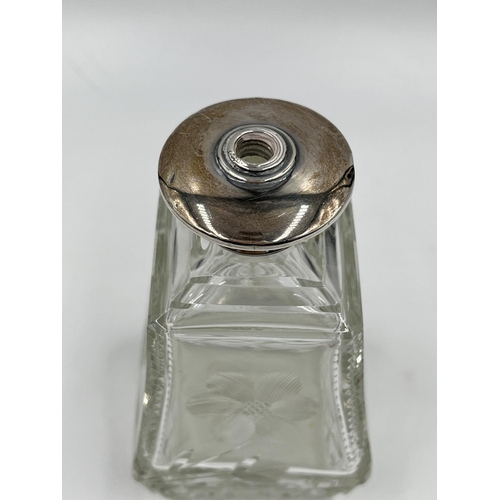 284 - Three cut glass scent bottles with sterling silver tops to include Victorian bottle, dated 1886 - ap... 