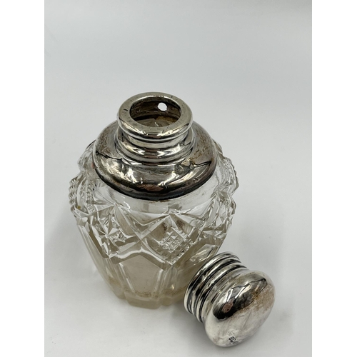 284 - Three cut glass scent bottles with sterling silver tops to include Victorian bottle, dated 1886 - ap... 