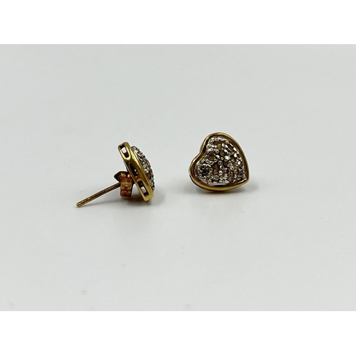 2344 - A pair of 9ct gold and diamond heart shaped earrings - approx. gross weight 1.3 grams