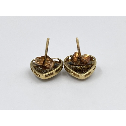 2344 - A pair of 9ct gold and diamond heart shaped earrings - approx. gross weight 1.3 grams