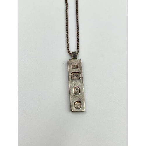 2339 - Two 925 silver necklaces, one 60cm with hallmarked London silver ingot pendant, dated 1980 and one 4... 