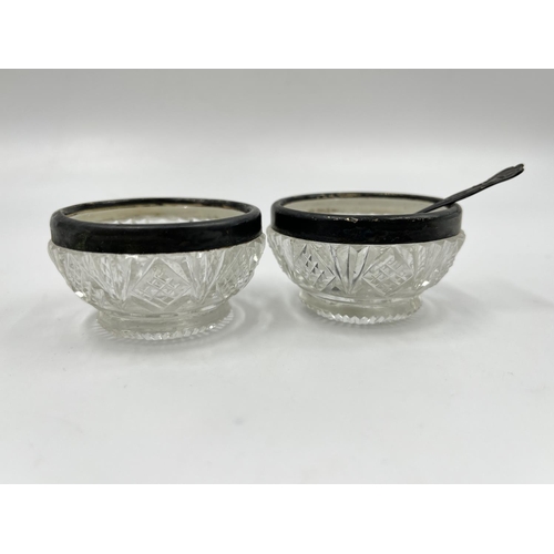 274 - A pair of antique cut glass salt cellars with hallmarked London silver collars and hallmarked Birmin... 