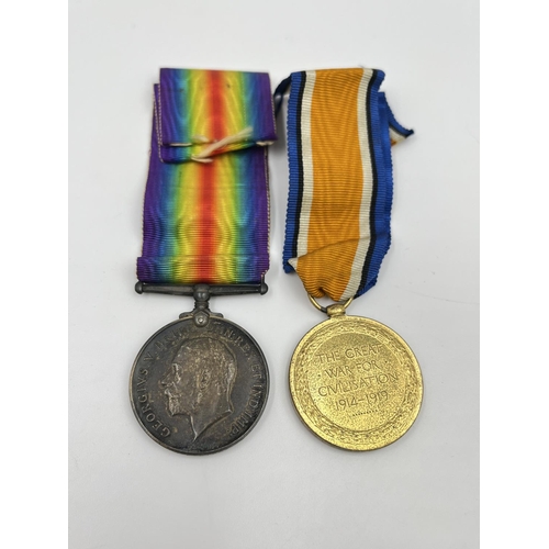 66 - A collection of ephemera and militaria to include WWI medal pair presented to PTE. J. F. Bibby of th... 