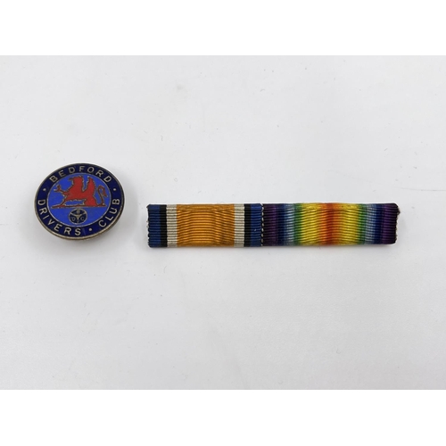 66 - A collection of ephemera and militaria to include WWI medal pair presented to PTE. J. F. Bibby of th... 