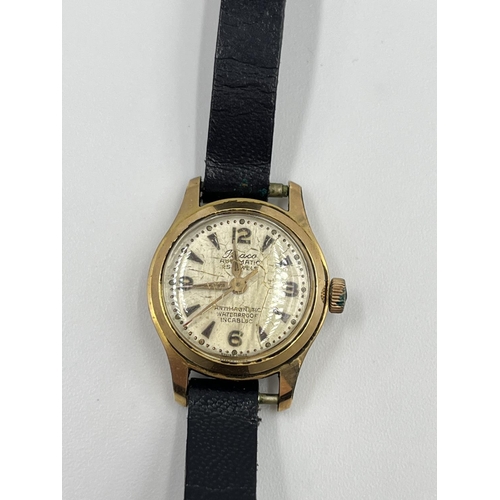 2409 - Three vintage women's wristwatches, Revue 9ct gold cased quartz with black leather strap, Rotary gol... 