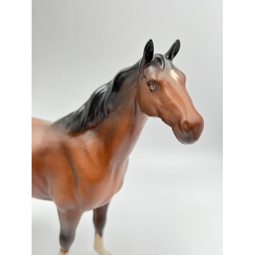 404 - A Beswick matte brown horse figurine - approx. 21cm high x 26cm long