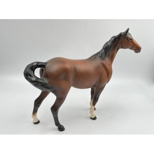 404 - A Beswick matte brown horse figurine - approx. 21cm high x 26cm long