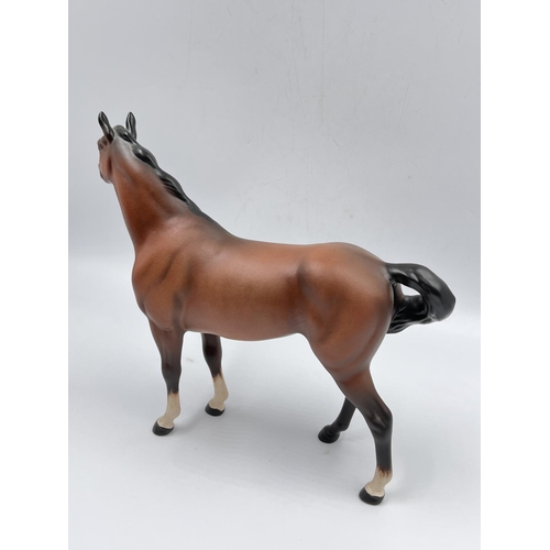 404 - A Beswick matte brown horse figurine - approx. 21cm high x 26cm long