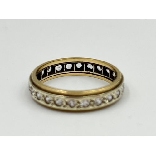 2332 - A two tone yellow and white metal CZ stone eternity ring, size P - approx. gross weight 3.34 grams