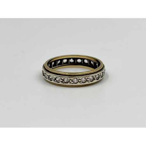 2332 - A two tone yellow and white metal CZ stone eternity ring, size P - approx. gross weight 3.34 grams