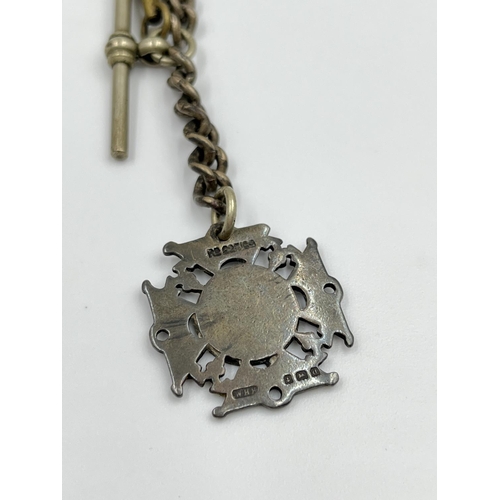 2348 - An antique white metal 29cm Albert chain with T bar, key and hallmarked Birmingham silver fob, dated... 