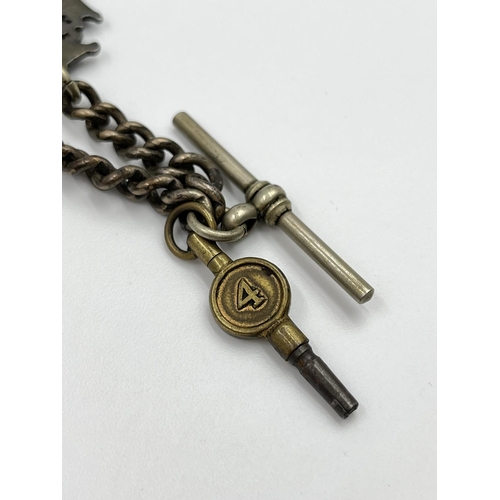 2348 - An antique white metal 29cm Albert chain with T bar, key and hallmarked Birmingham silver fob, dated... 