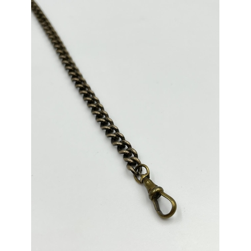 2348 - An antique white metal 29cm Albert chain with T bar, key and hallmarked Birmingham silver fob, dated... 