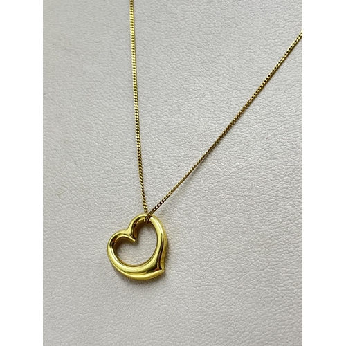 2353 - A 9ct gold diamond heart pendant necklace - approx. gross weight 1 gram